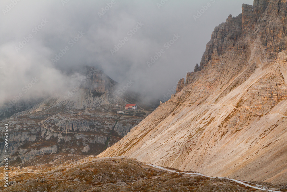 Tre Cime di Lavaredo in beautiful surroundings in the Dolomites at foggy weather   (Drei Zinnen)