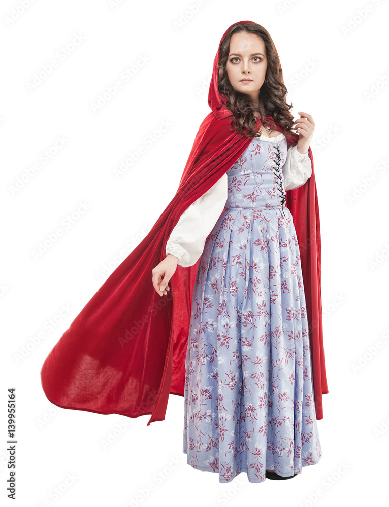 Young beautiful woman in long medieval dress and red cloak Young beautiful woman in long medieval dress and red cloak