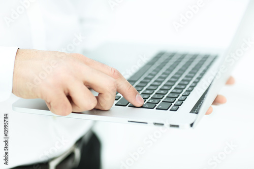 Hand of businessman on keyboard