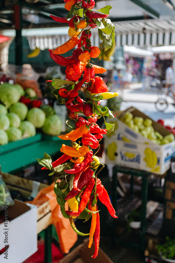 Naklejka premium Red and green pepper hanging on the market in Omis, Croatia.