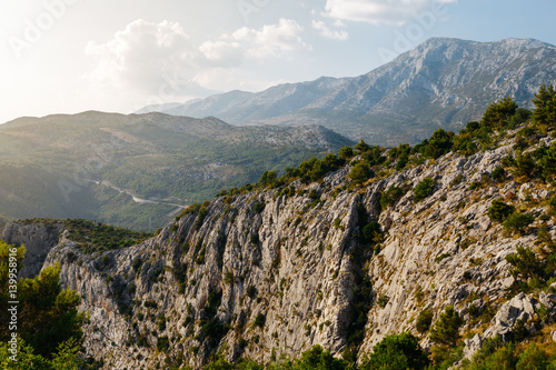 The slope of the cliff in the rays of the sun near Omis, Croatia. © s1rus