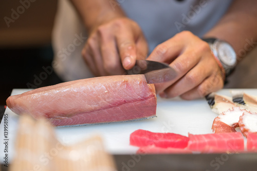 chef preparing sushi in the restaurant kitchen