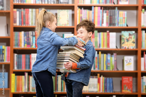 schoolboy and schoolgirl in the library

