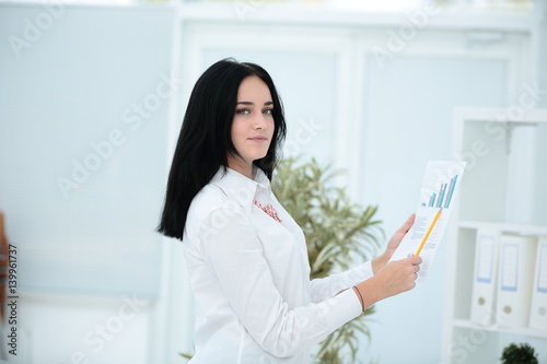 Free Download Portrait of a young businesswoman in modern office - GFXLoad
