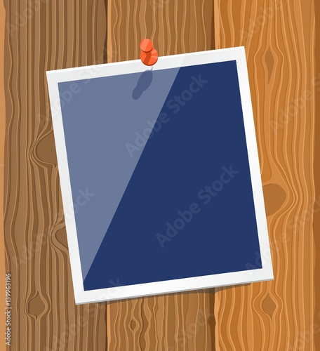 Photo frame on wood texture
