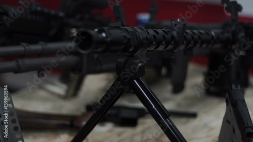 The machine-gun is on the bipods on the floor photo