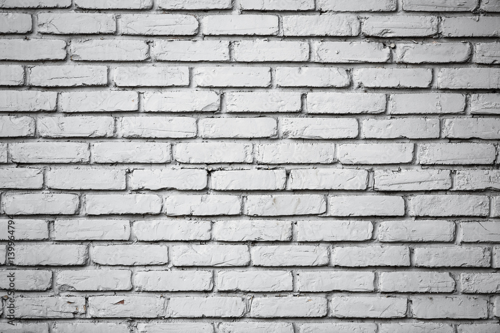Old brick wall with peeling paint.Rough stone masonry.Vintage Design Element.Worn, broken wall requiring painting Old brick wall with peeling paint.Rough stone masonry.Vintage Design Element.Worn, broken wall requiring painting
