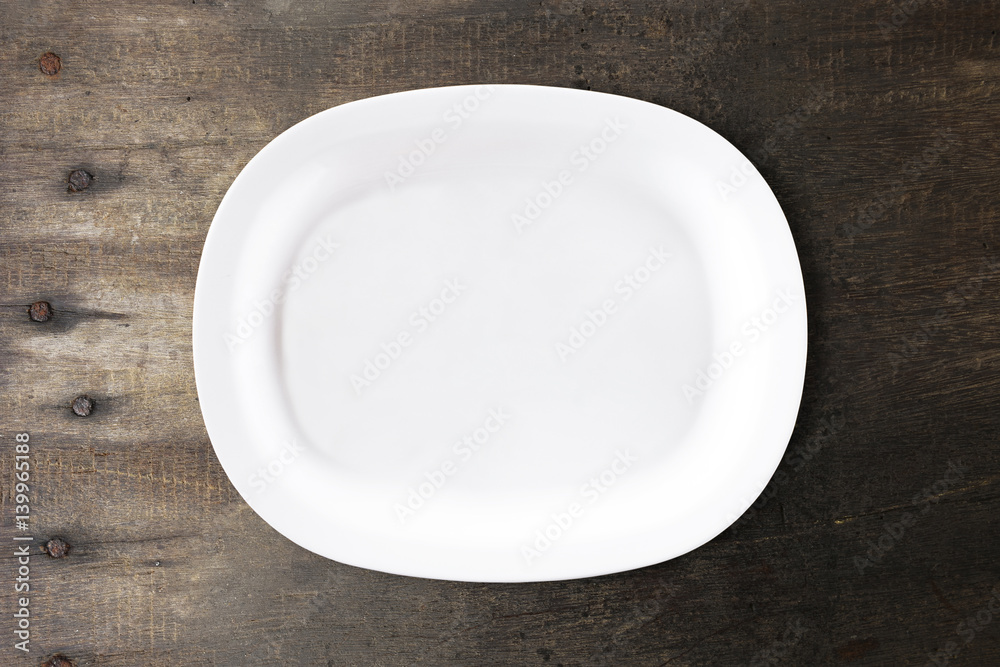 White bowl isolated on wooden background for image decorative with clipping path. White bowl isolated on wooden background for image decorative with clipping path.