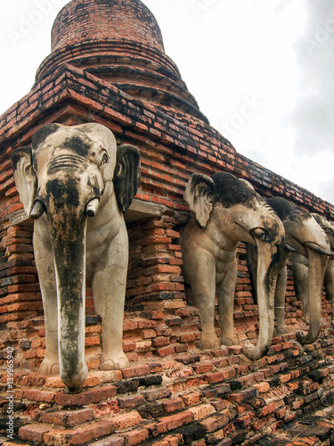 Elephant Statues in Ancient Stupa in Sukhothai Thailand photo