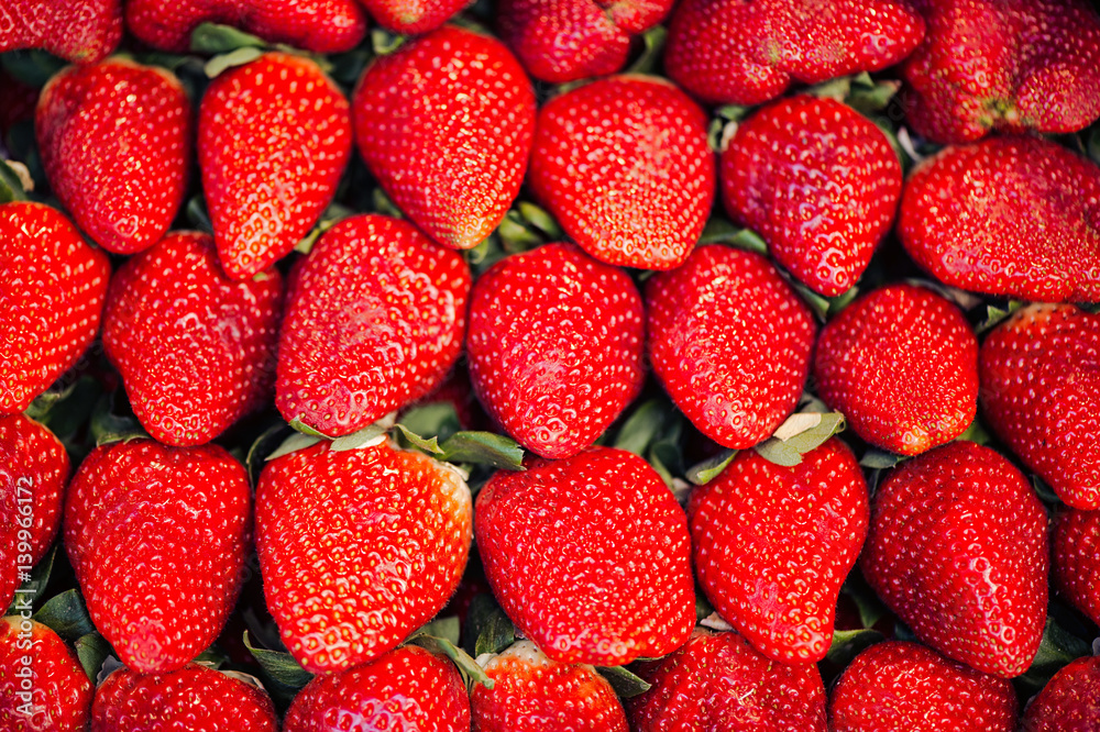 Macro photo of a lot of strawberries in full frame. Food Concept