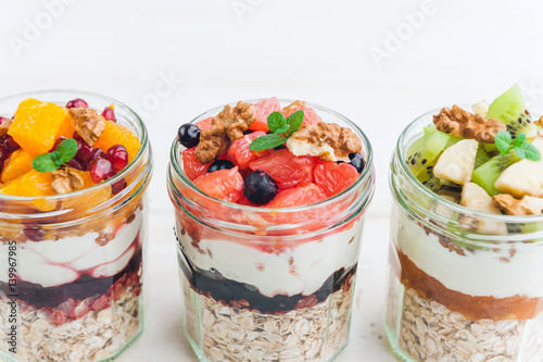 Oatmeal with fruit and cereals in a glass jar
