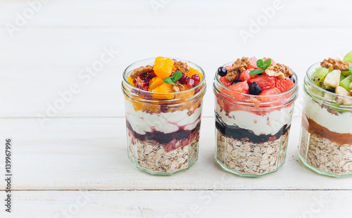 Oatmeal with fruit and cereals in a glass jar