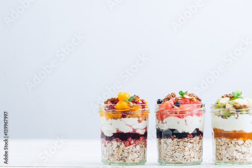 Oatmeal with fruit and cereals in a glass jar