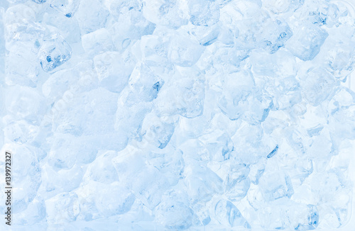 Ice cubes blue background.