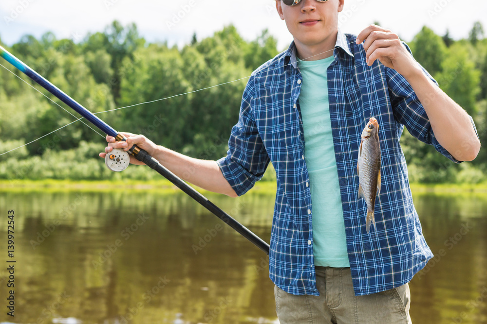 Fisherman caught a bream on the river Fisherman caught a bream on the river