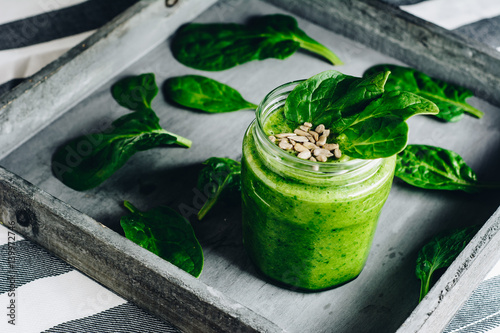 Spinach smoothie with banana and orande photo