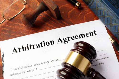 Arbitration agreement form on an office table.