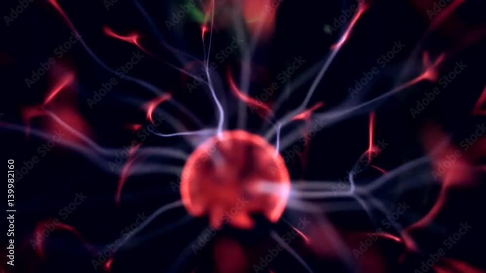 A Plasma Globe with Filaments extending between the Inner and Outer Spheres. Close-up. A Plasma Globe with Filaments extending between the Inner and Outer Spheres. Close-up.