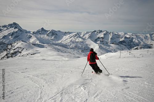 Girl enjoying a ski ride in the Alps