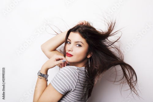 Fashion model girl portrait with long blowing hair.