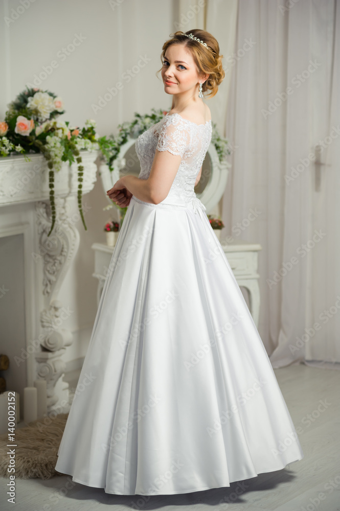Beautiful bride before wedding ceremony in appartament Beautiful bride before wedding ceremony in appartament