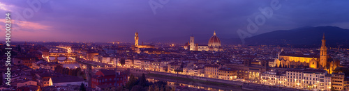Panorama of famous Florence city and river Arno after sunset with night illumination, Tuscany, Italy, Europe. Travel outdoor sightseeing background. © Roxana