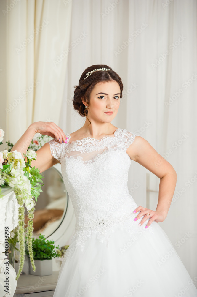 Beautiful bride before wedding ceremony in appartament Beautiful bride before wedding ceremony in appartament