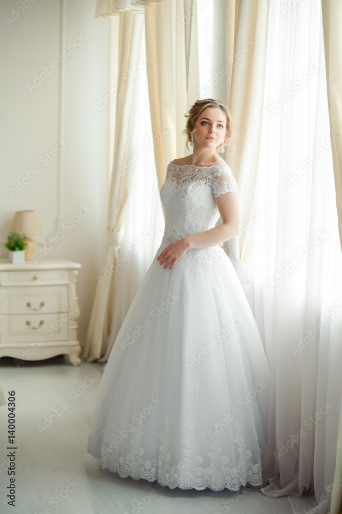 Beautiful bride before wedding ceremony in appartament Beautiful bride before wedding ceremony in appartament