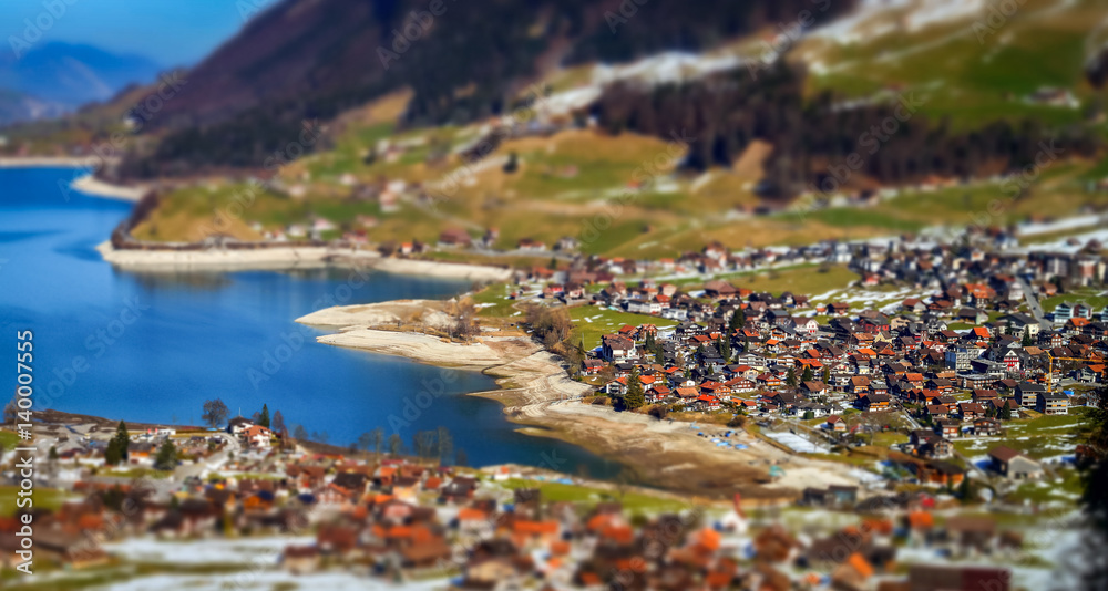 Miniature tilt-shift aerial view of the village in Alps