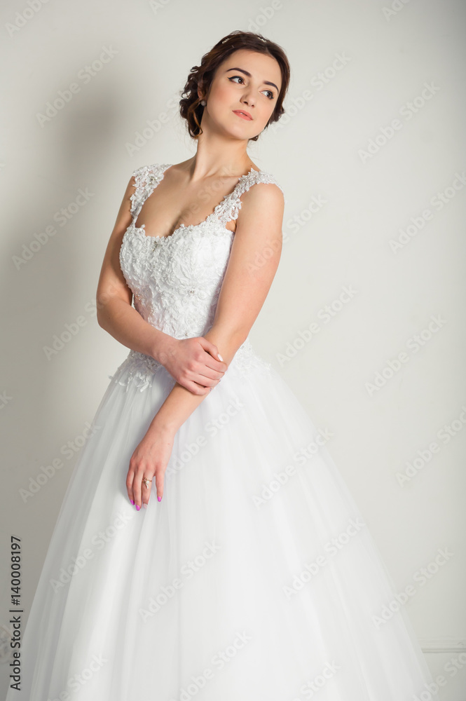 Smiling bride holding big wedding bouquet Smiling bride holding big wedding bouquet