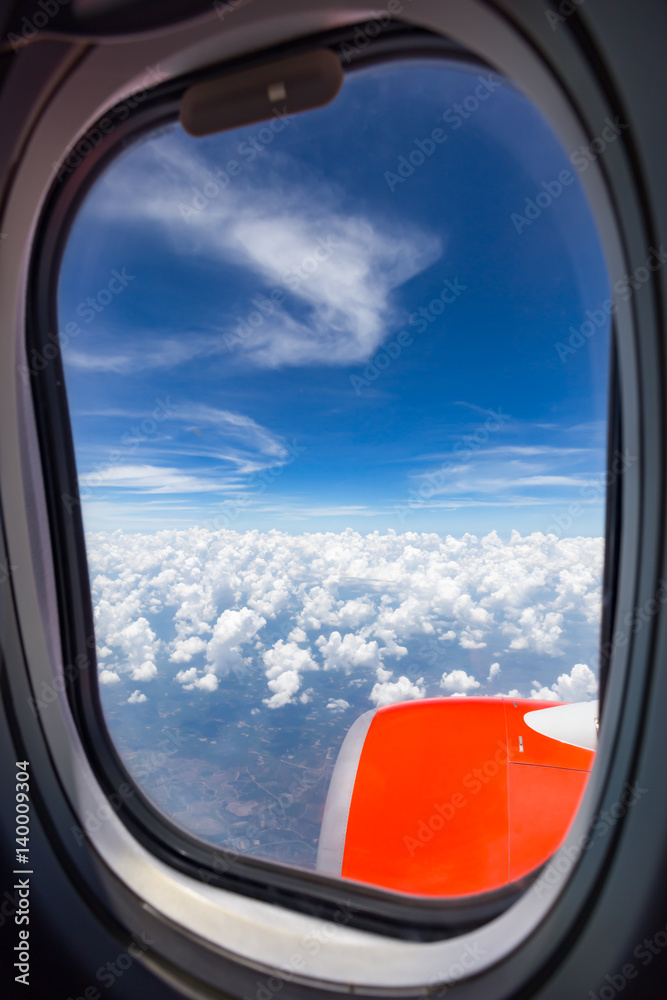 View from a jet plane window high on the blue skies,Airplane windows.