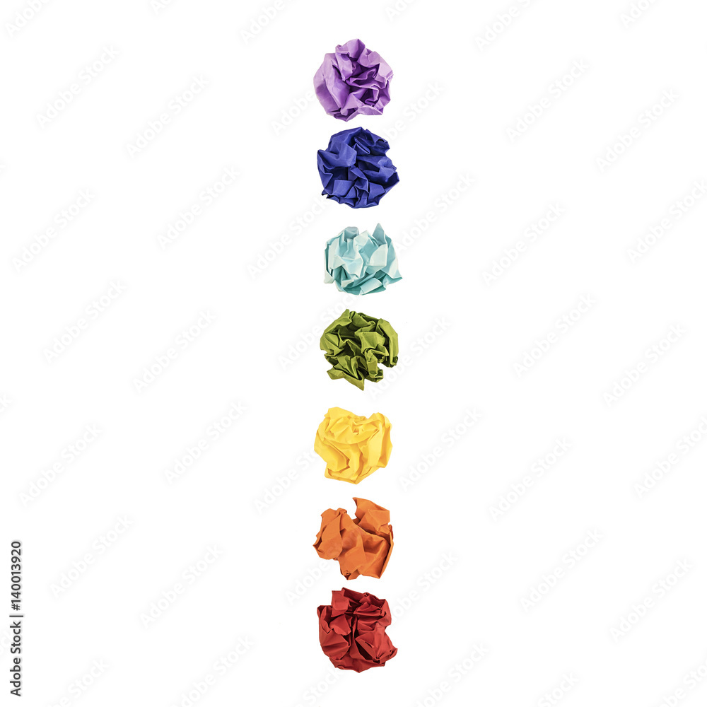 Crumpled colorful paper balls isolated on white. Colors of rainbow, chakras. Copy space - obrazy, fototapety, plakaty 