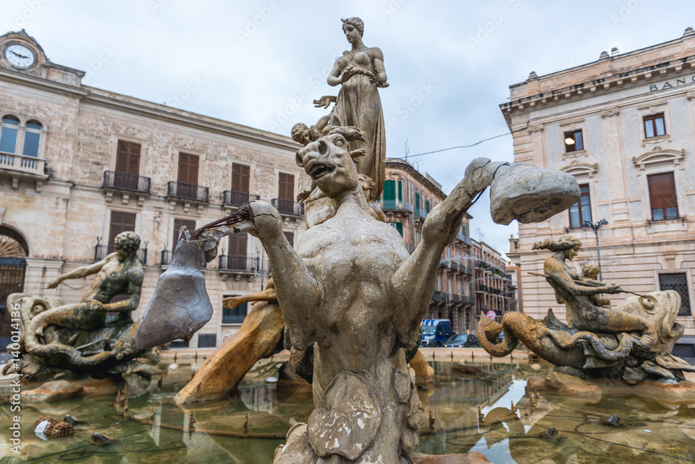 Famous Artemis (Diana) Fountain on Archimedes Square on the Ortygia isle - old town of Syracuse on Sicily island, Italy