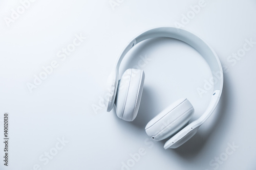 white wireless headphone on the white table photo