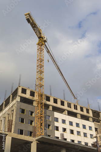 Building and Construction Concepts. Construction Building Site With Industrial Mid-Size Crane.