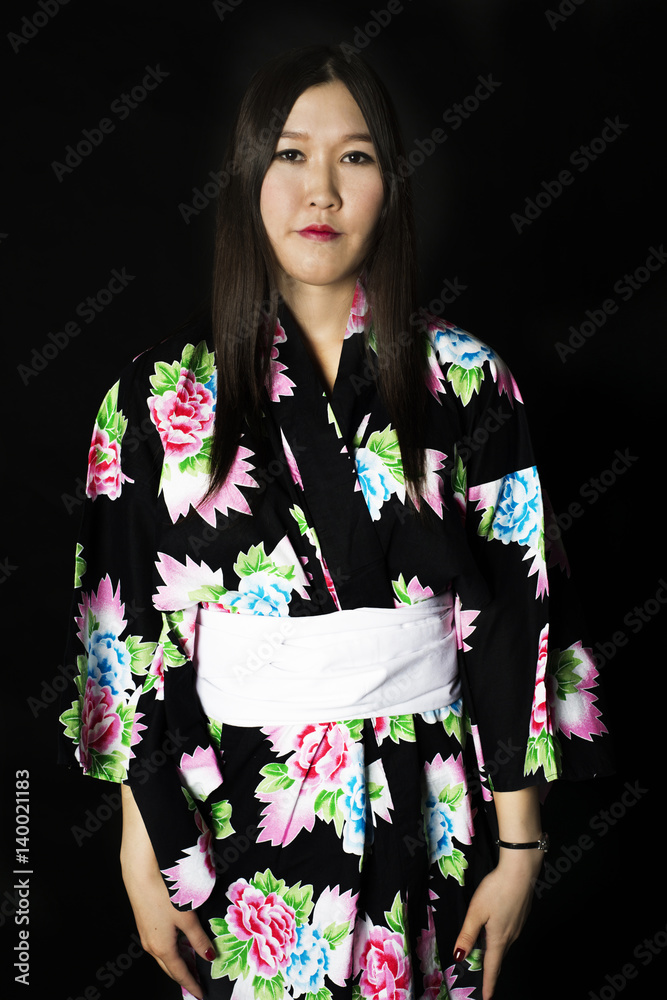 Japanese girl in traditional Japanese kimono on black background. Japanese girl in traditional Japanese kimono on black background.