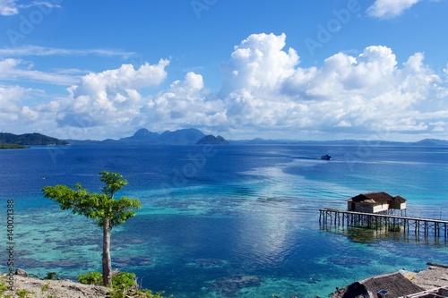 Bild auf Leinwand island house stilts view indonesia togian sulawesi