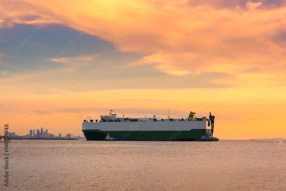 Cargo container ship at sunset