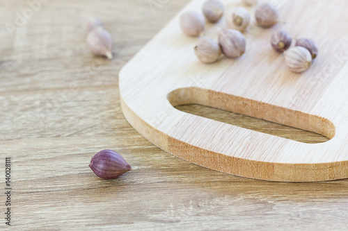Garlic on wood cutting board