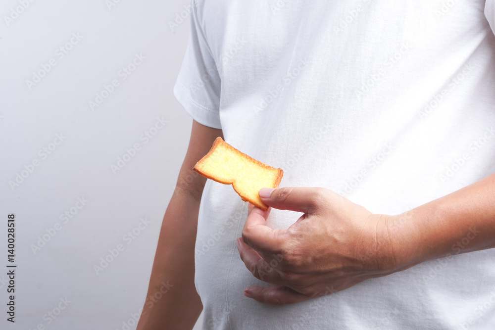 Hand holding butter rusk bread loaf Hand holding butter rusk bread loaf