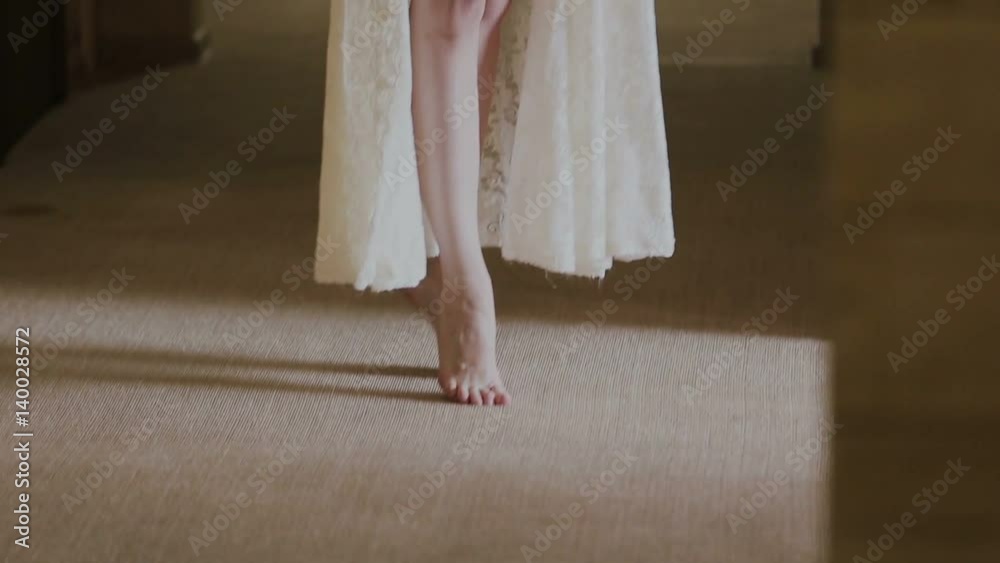 Legs of a woman in a white coat Legs of a woman in a white coat