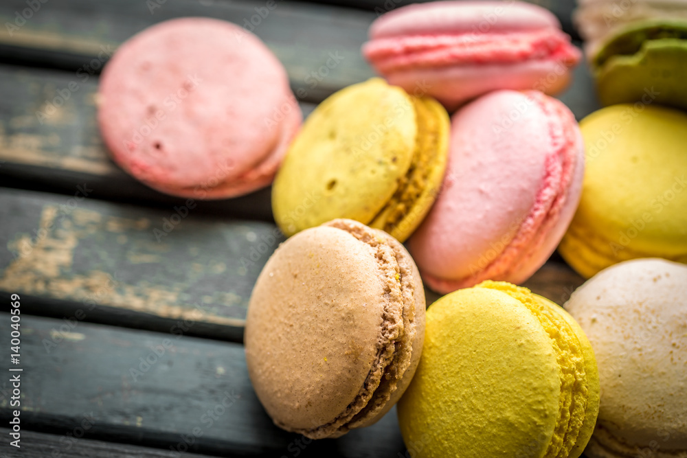 Colorful macaroons on wooden background Colorful macaroons on wooden background
