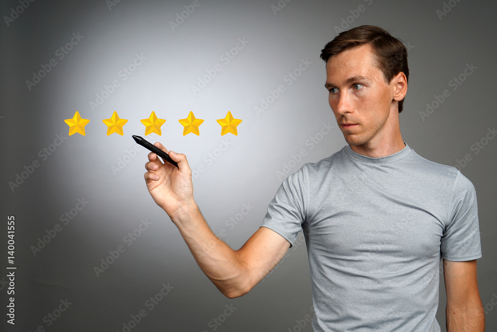 Five star rating or ranking, benchmarking concept. Man assesses service, hotel, restaurant Five star rating or ranking, benchmarking concept. Man assesses service, hotel, restaurant