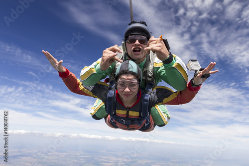 Tandem jump. The girl with the instructor in freefall. © German Skydiver
