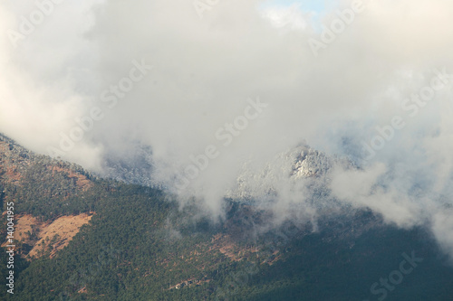 Atmospheric clouds of fog cover the top of the mountain. Crimea. Yalta. Ay Petrinskaya Yaila