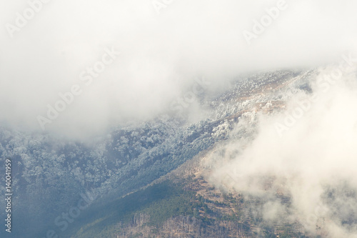 Atmospheric clouds of fog cover the top of the mountain. Crimea. Yalta. Ay Petrinskaya Yaila