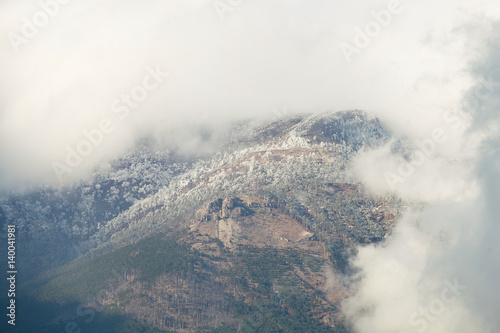Atmospheric clouds of fog cover the top of the mountain. Crimea. Yalta. Ay Petrinskaya Yaila