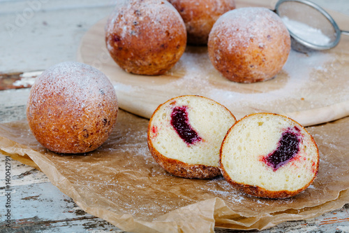 Small doughnuts filled with jam photo