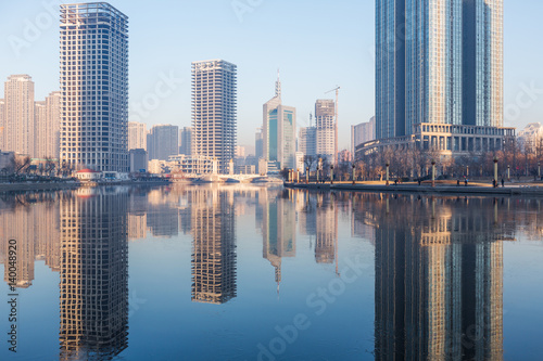 River And Modern Buildings Against Sky in Tianjin China.