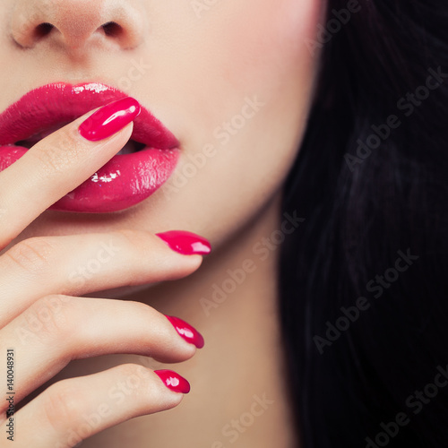 Pink Female Lips and Manicure Hand Close up. Lip Gloss Makeup  Beauty Background